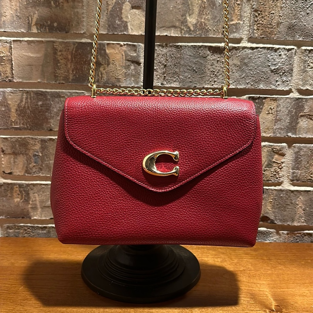 COACH - Red. Pebble leather Red Crossbody with gold hardware and chain strap.